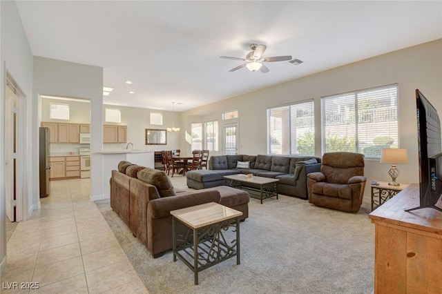 living room featuring ceiling fan and light tile patterned floors