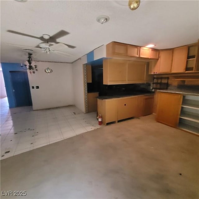 kitchen featuring ceiling fan and backsplash