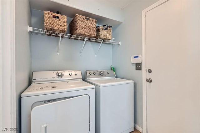 laundry area with washing machine and clothes dryer