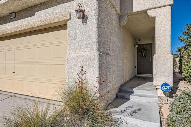 property entrance featuring a garage