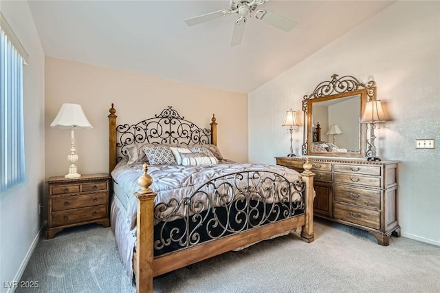 carpeted bedroom with ceiling fan and lofted ceiling