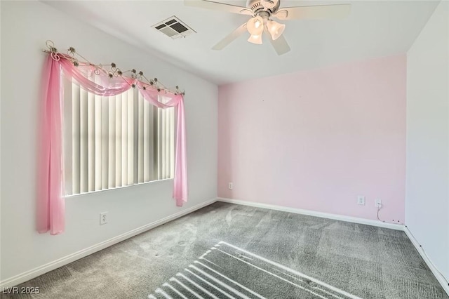 spare room with carpet and ceiling fan