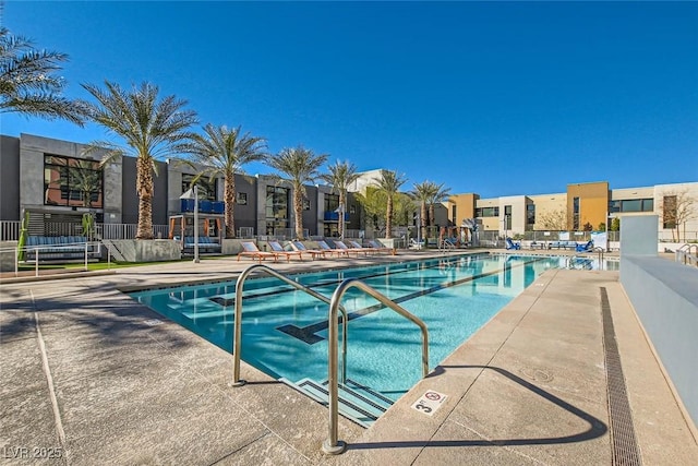 view of swimming pool with a patio