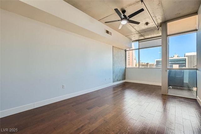 unfurnished room featuring dark hardwood / wood-style floors and ceiling fan