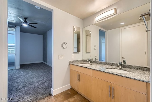 bathroom with ceiling fan and vanity