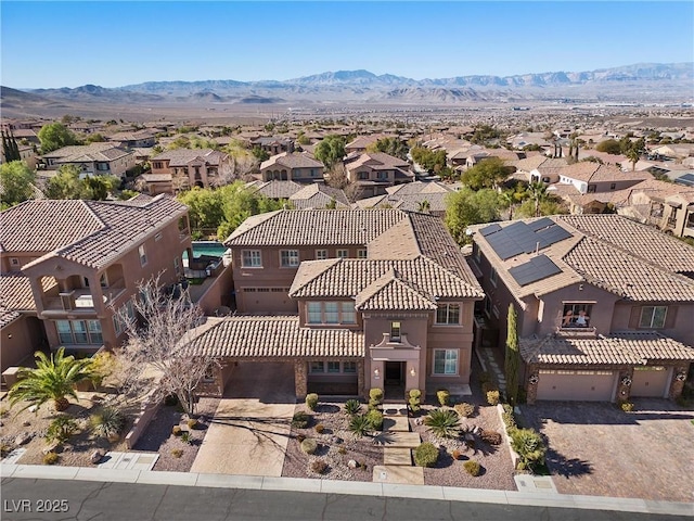 drone / aerial view with a residential view and a mountain view