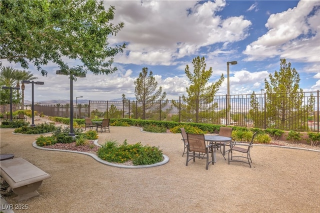 surrounding community featuring a patio and fence