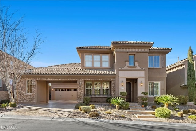 mediterranean / spanish-style house featuring a tile roof, stucco siding, an attached garage, stone siding, and driveway