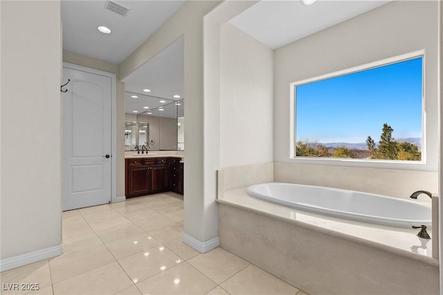 full bathroom with baseboards, visible vents, tile patterned floors, vanity, and a bath