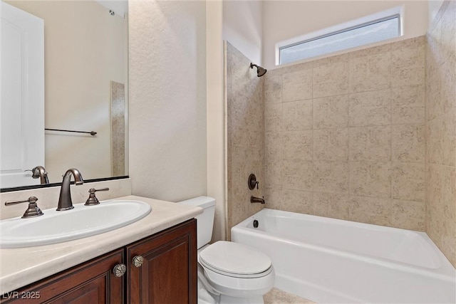 full bathroom featuring vanity, bathtub / shower combination, and toilet