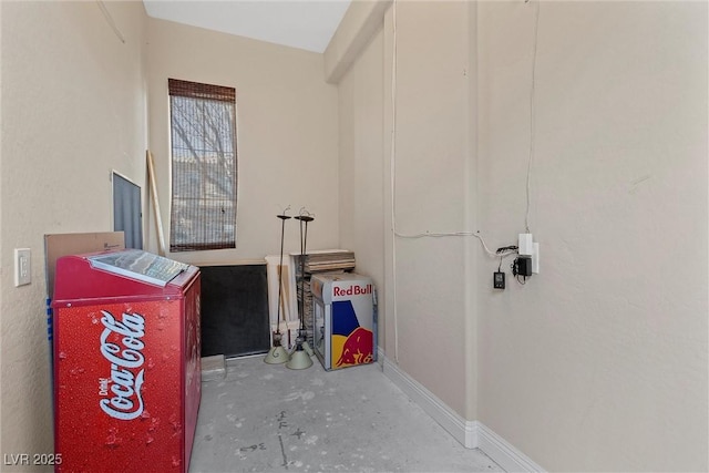 interior space featuring baseboards