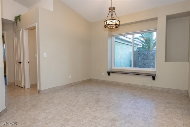 empty room featuring a notable chandelier