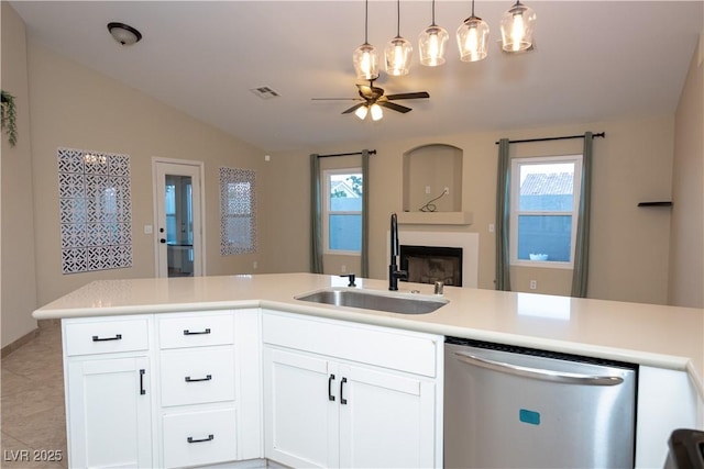 kitchen with sink, white cabinets, a healthy amount of sunlight, and dishwasher