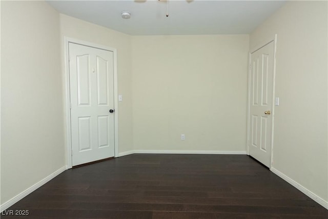 spare room featuring dark hardwood / wood-style flooring