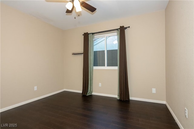 unfurnished room with ceiling fan and dark hardwood / wood-style floors