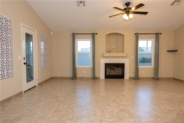 unfurnished living room featuring lofted ceiling and ceiling fan