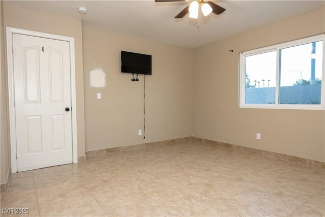 unfurnished room with ceiling fan