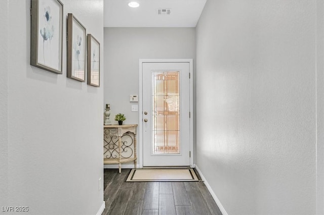 doorway to outside featuring dark hardwood / wood-style floors and a wealth of natural light