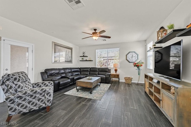 living room with dark wood-type flooring and ceiling fan