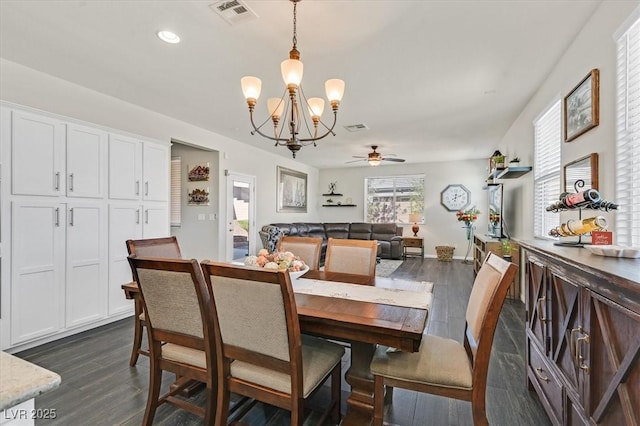 dining area featuring dark hardwood / wood-style flooring, ceiling fan, and a healthy amount of sunlight