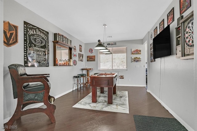 recreation room featuring dark wood-type flooring