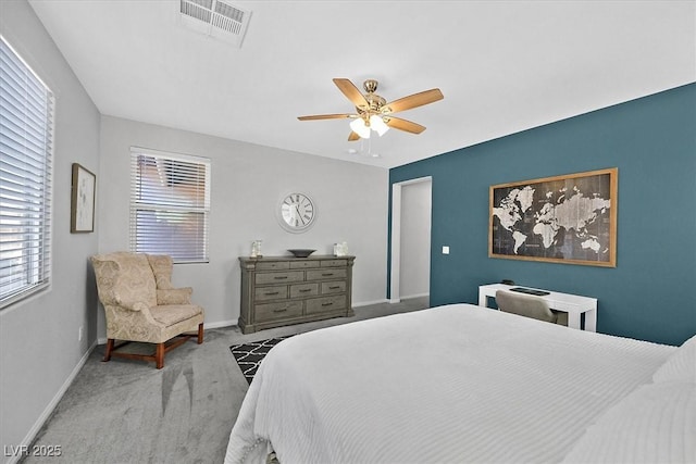 bedroom featuring light carpet and ceiling fan