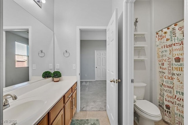 bathroom featuring vanity, curtained shower, and toilet