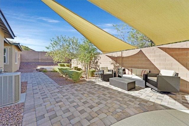 view of patio featuring an outdoor living space and central air condition unit