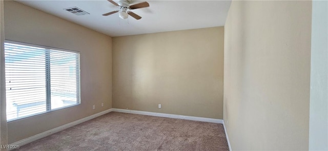 carpeted empty room featuring ceiling fan