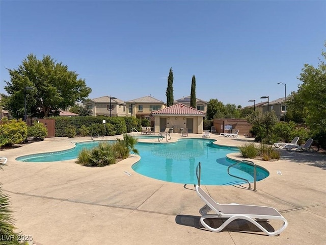 view of swimming pool with a patio