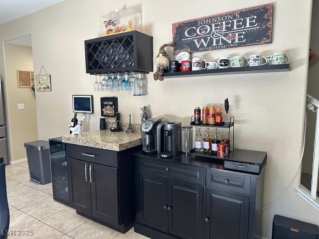 bar featuring light tile patterned flooring