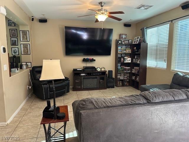 living room with light tile patterned flooring and ceiling fan