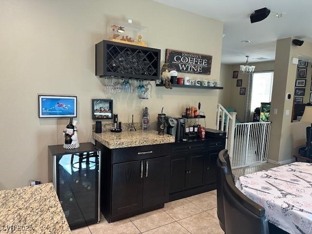 bar featuring bar area and light tile patterned flooring