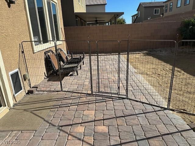 view of patio with a fenced backyard and a gate