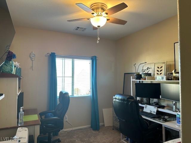 home office with ceiling fan and carpet floors