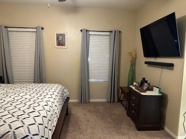 bedroom with ceiling fan and carpet