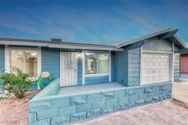 entrance to property featuring a garage