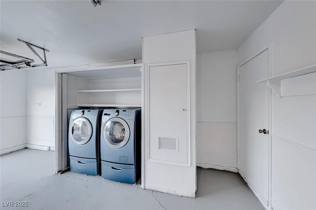 laundry room featuring washing machine and dryer