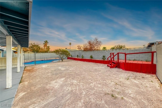 exterior space featuring a fenced in pool