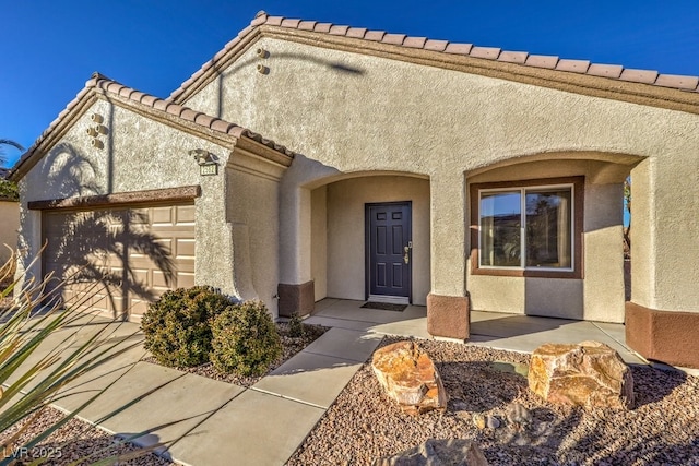 property entrance featuring a garage