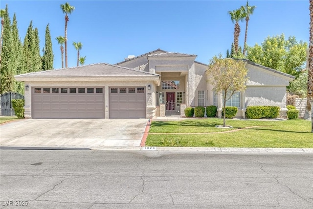 view of front of property with a front lawn and a garage