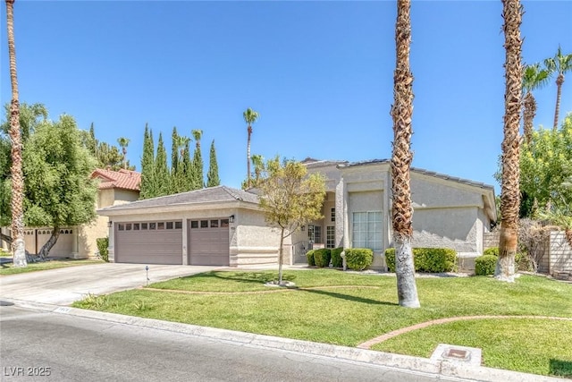 view of front of house featuring a garage and a front yard