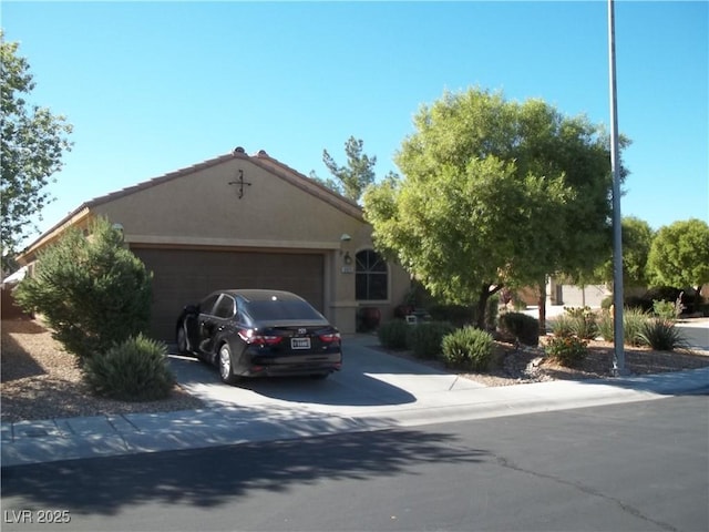 ranch-style home featuring a garage