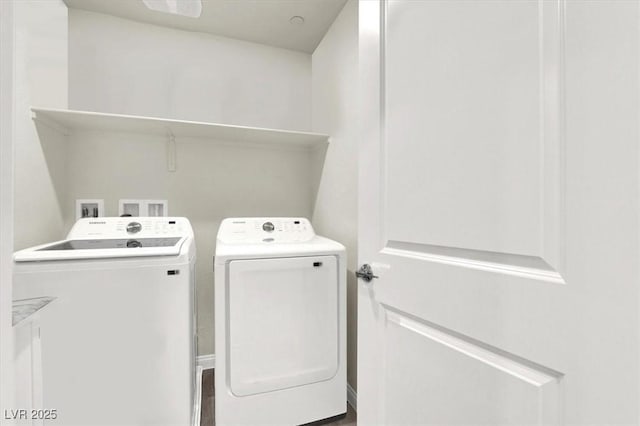 clothes washing area with separate washer and dryer