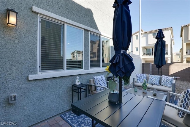 deck with an outdoor living space and a patio area