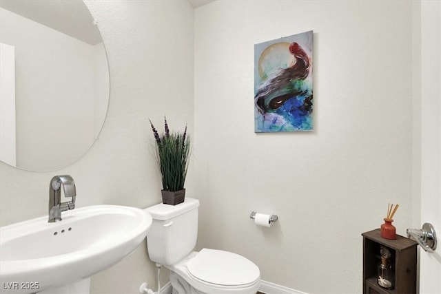 bathroom with sink and toilet