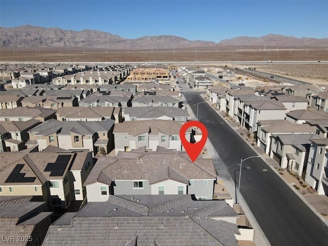 birds eye view of property featuring a mountain view