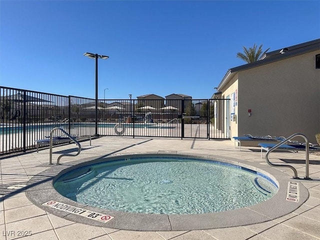 view of swimming pool featuring a patio