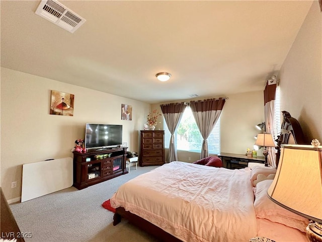 bedroom featuring light carpet