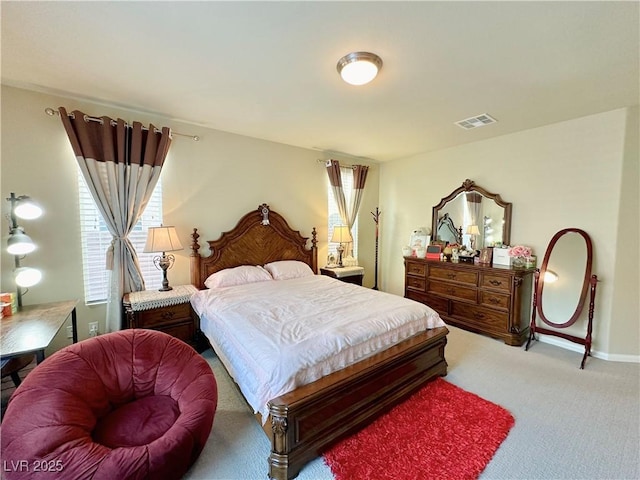 bedroom featuring multiple windows and carpet floors